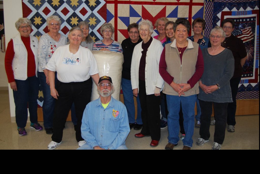 Dennis And Lynn (front) And The Quilting Cowpokes of Cheyenne (image)